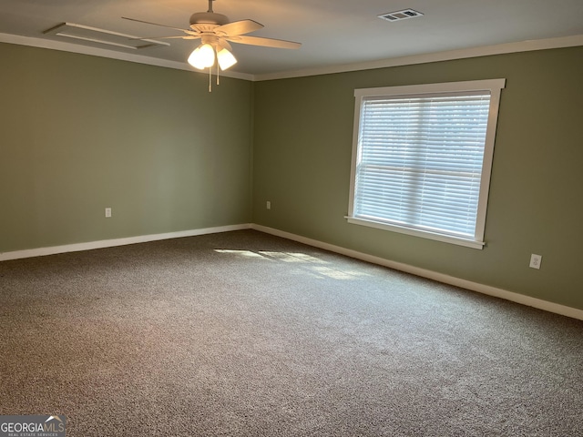 carpeted empty room featuring ornamental molding and ceiling fan