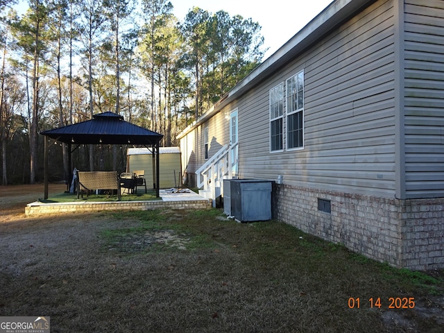 view of yard featuring a gazebo and a patio