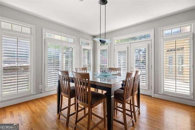 dining area with light hardwood / wood-style floors