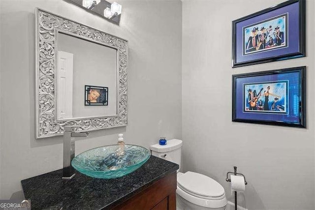 bathroom with vanity and toilet