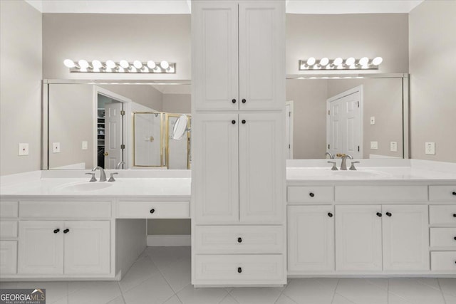 bathroom featuring walk in shower and vanity