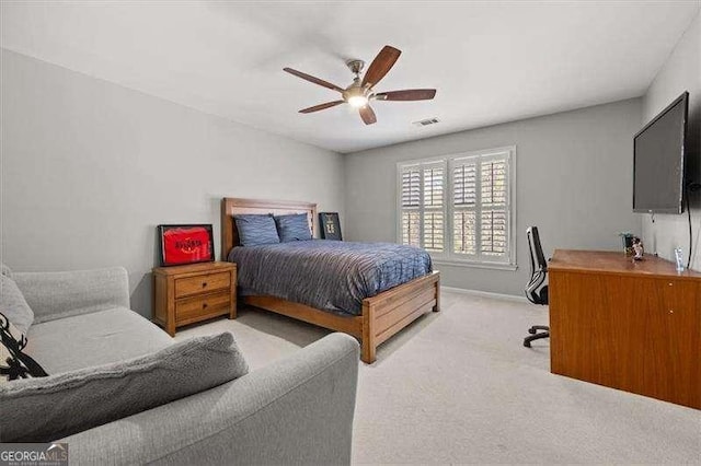 bedroom with light colored carpet and ceiling fan