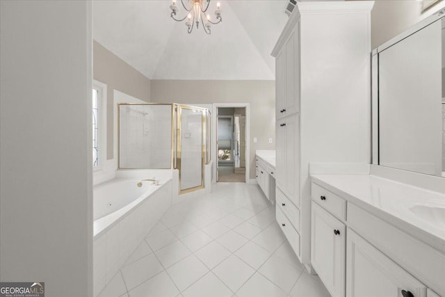 bathroom featuring lofted ceiling, vanity, tile patterned flooring, and shower with separate bathtub