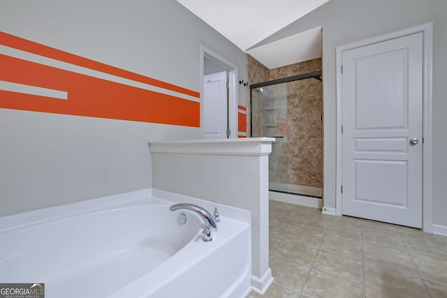 bathroom featuring vaulted ceiling, plus walk in shower, and tile patterned flooring