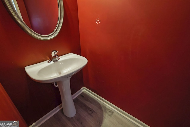 bathroom featuring sink and wood-type flooring