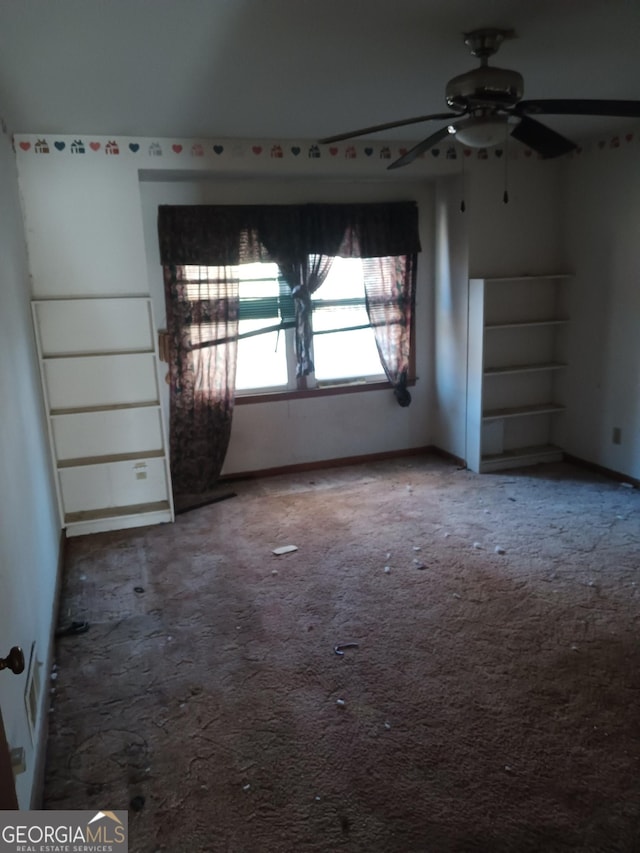 carpeted empty room with ceiling fan