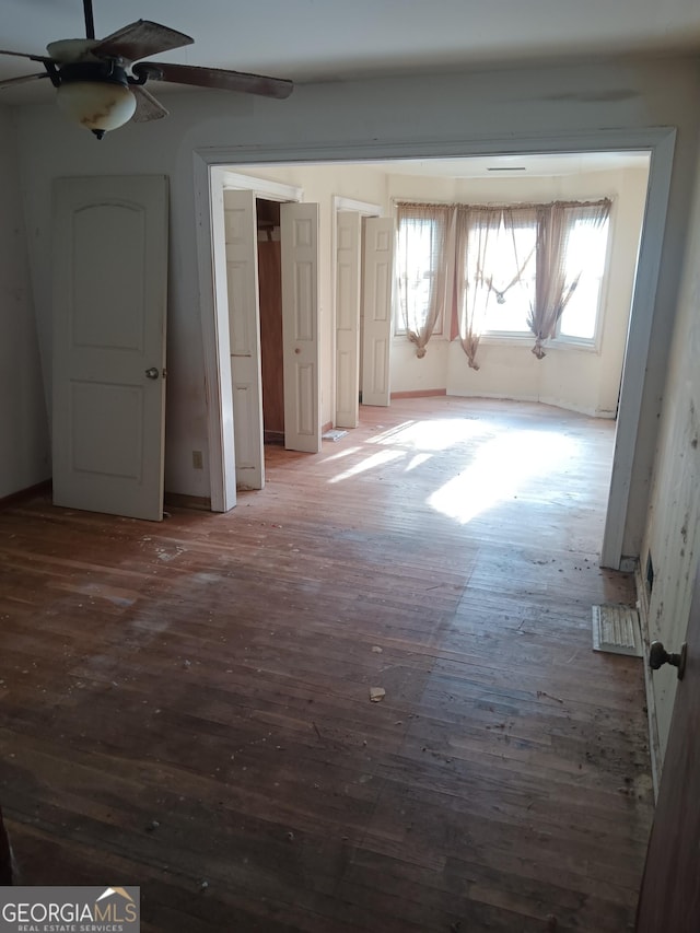 interior space featuring dark hardwood / wood-style floors and ceiling fan