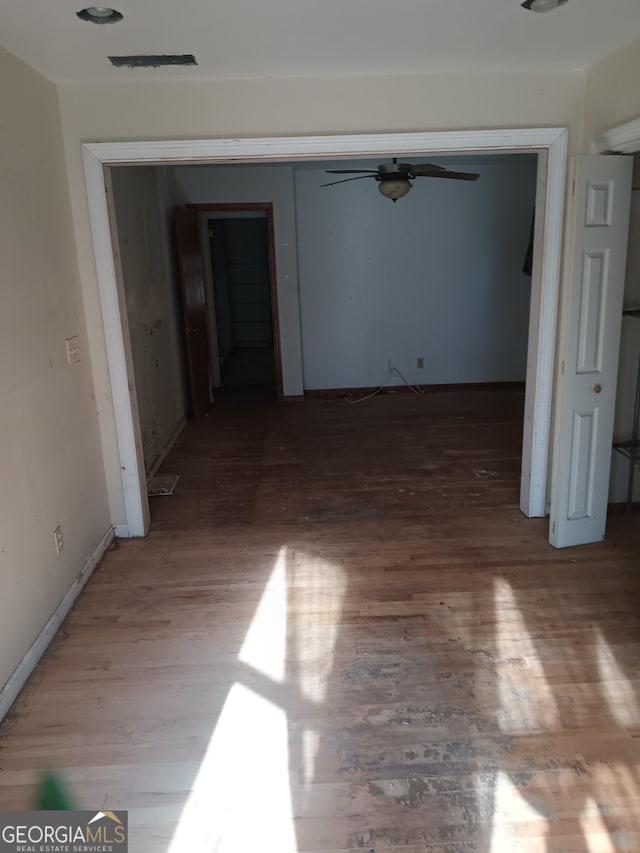 spare room with hardwood / wood-style flooring