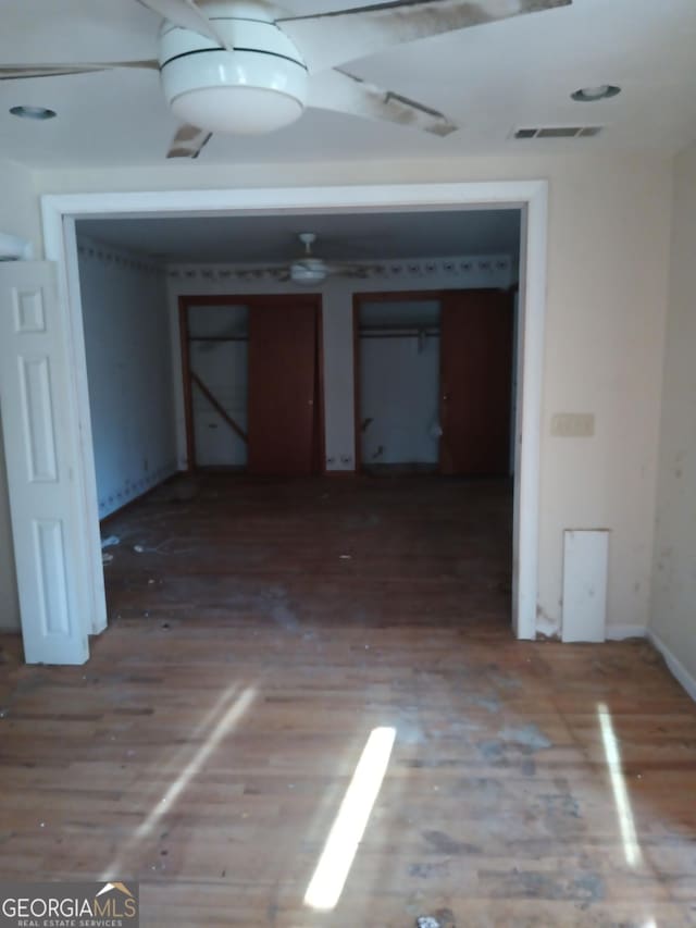 empty room with hardwood / wood-style flooring