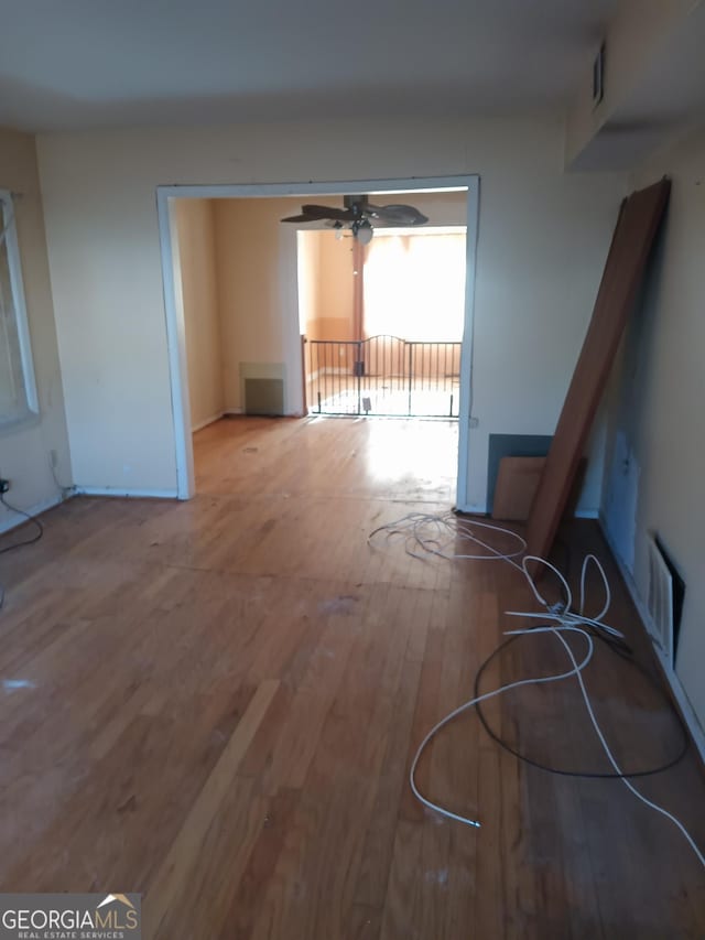 interior space featuring hardwood / wood-style floors and ceiling fan