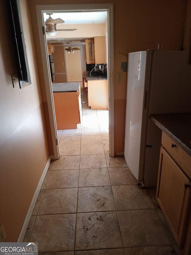 hallway featuring light tile patterned flooring