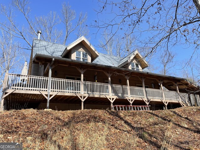 view of property exterior featuring a deck