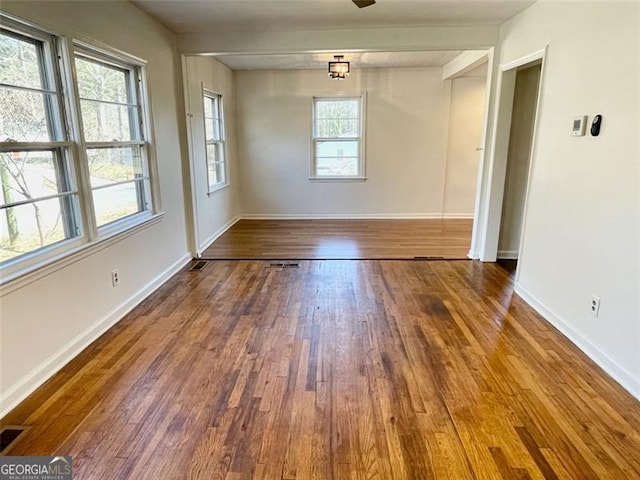 unfurnished room featuring hardwood / wood-style flooring