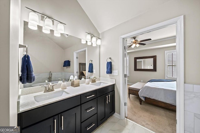 bathroom with vanity, vaulted ceiling, and ceiling fan