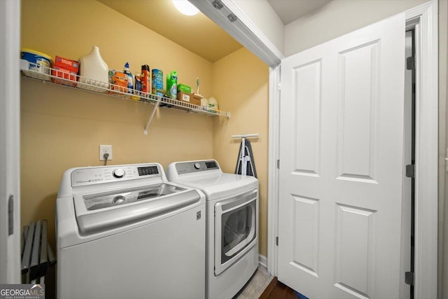 washroom with washer and clothes dryer