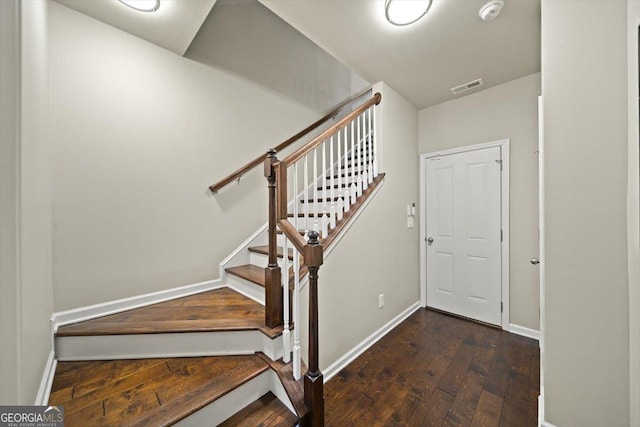 stairway with wood-type flooring