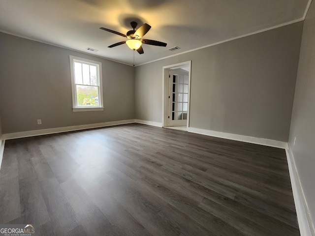 unfurnished room featuring ornamental molding, dark wood-type flooring, and ceiling fan