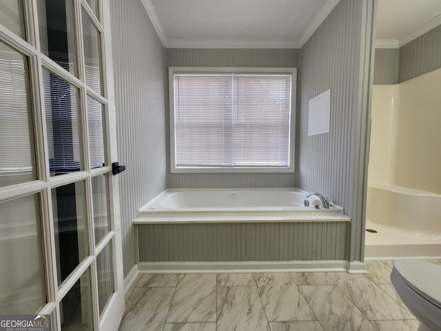 bathroom featuring crown molding, toilet, and separate shower and tub