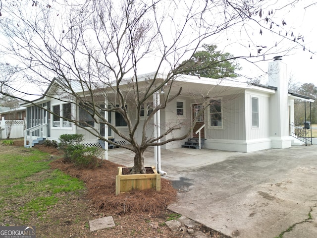 view of front of house featuring a sunroom