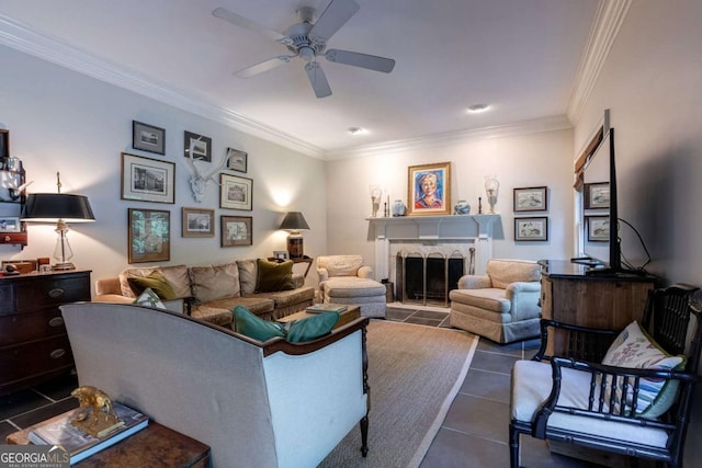 living room featuring crown molding, dark tile patterned flooring, and ceiling fan