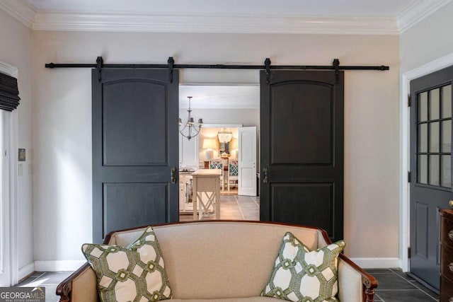 tiled entrance foyer featuring crown molding, a barn door, and a chandelier