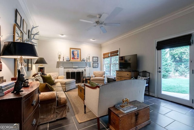 tiled living room with ornamental molding and ceiling fan