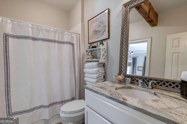 bathroom featuring beamed ceiling, vanity, curtained shower, and toilet