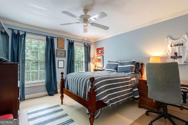 bedroom with crown molding, ceiling fan, and carpet flooring