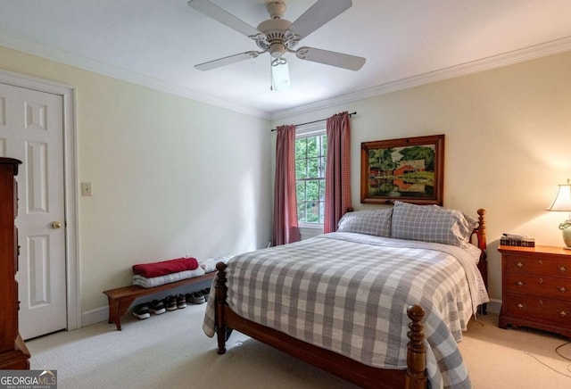 bedroom featuring crown molding, light colored carpet, and ceiling fan