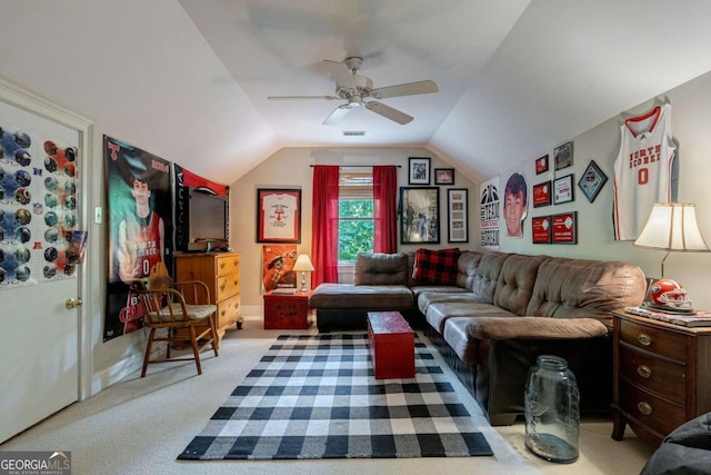 living room featuring vaulted ceiling, light colored carpet, and ceiling fan