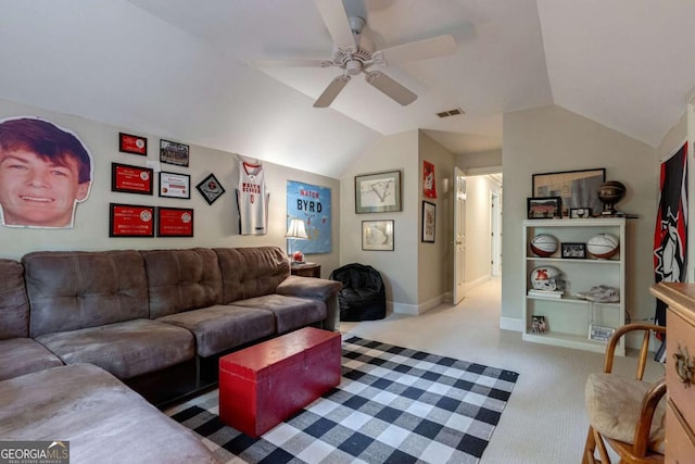 carpeted living room with vaulted ceiling and ceiling fan