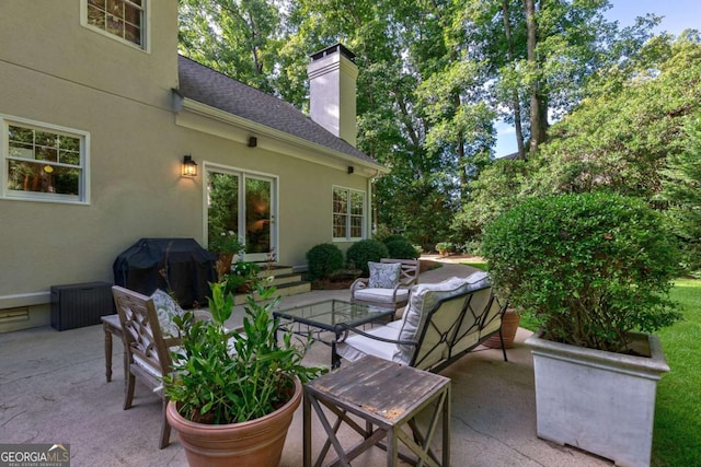 view of patio featuring an outdoor living space and grilling area