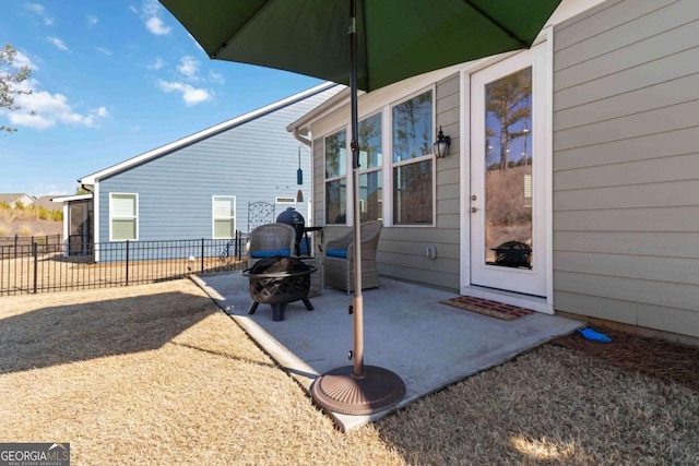 view of patio / terrace with an outdoor fire pit