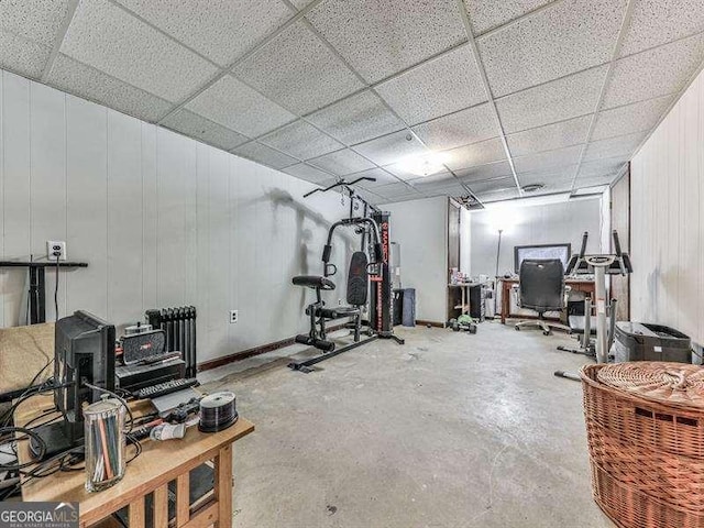 exercise room featuring a drop ceiling