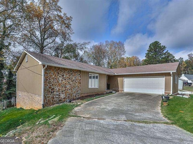 single story home featuring a garage