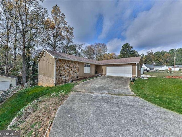 view of front of home with a garage and a front yard