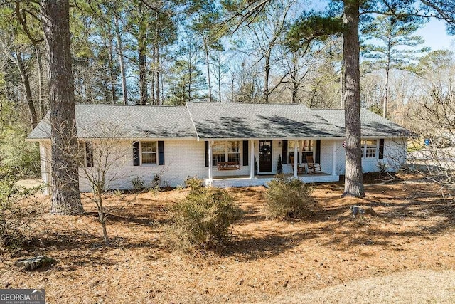 single story home featuring covered porch