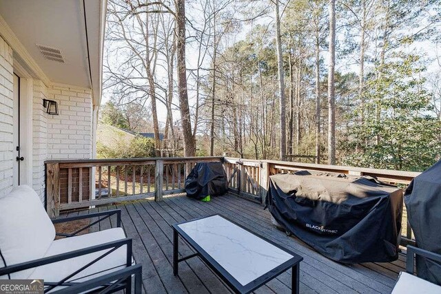 wooden terrace with grilling area