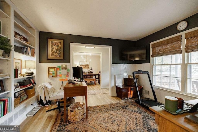 office space with light hardwood / wood-style flooring