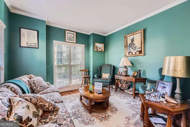 sitting room featuring wood-type flooring and ornamental molding