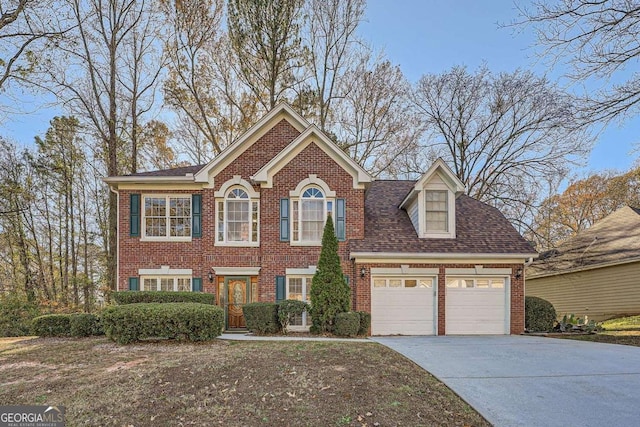 view of front of property with a garage