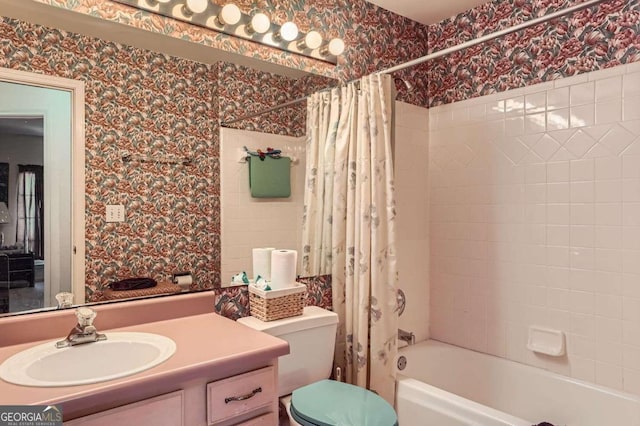 full bathroom featuring shower / tub combo with curtain, vanity, and toilet