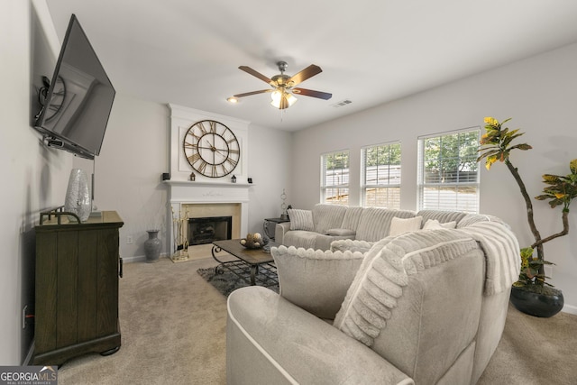 living room featuring light colored carpet and ceiling fan