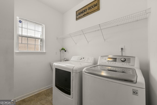 clothes washing area featuring washing machine and clothes dryer