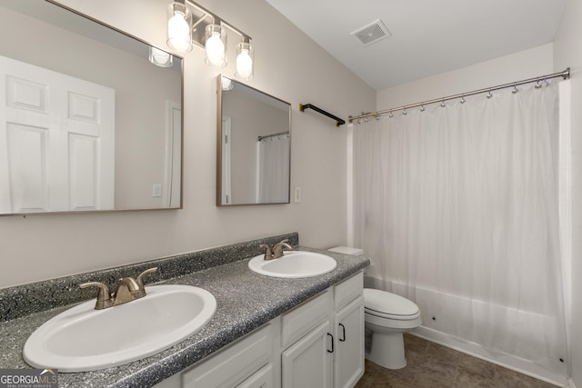 full bathroom featuring vanity, tile patterned floors, toilet, and shower / bathtub combination with curtain