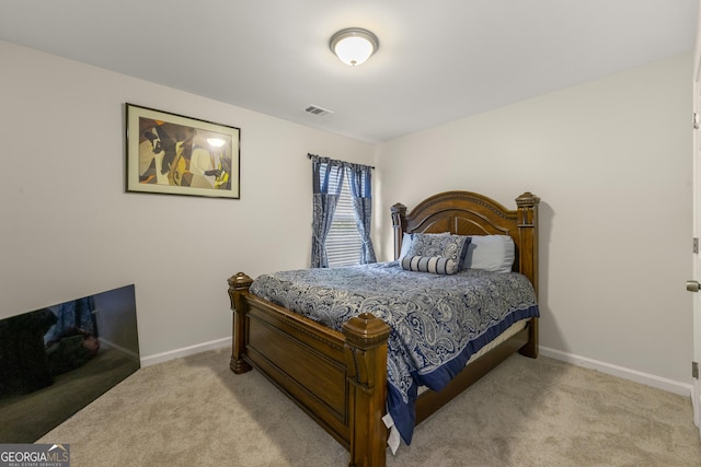 bedroom featuring light colored carpet