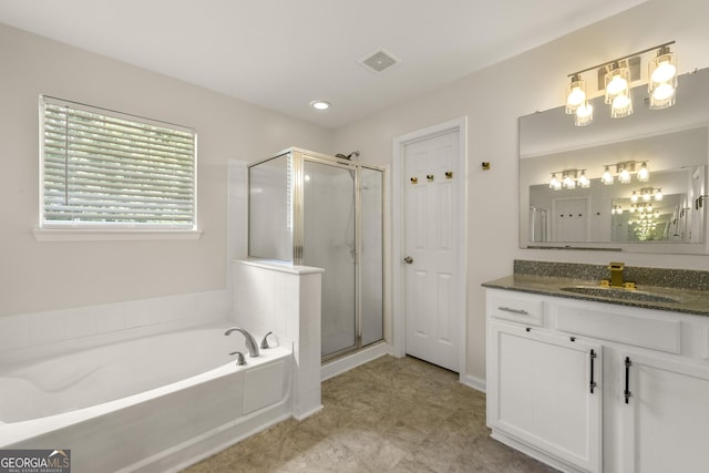 bathroom featuring plus walk in shower and vanity