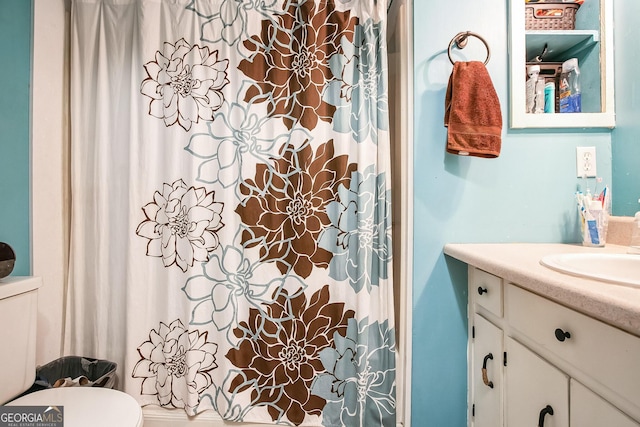 bathroom with vanity and toilet