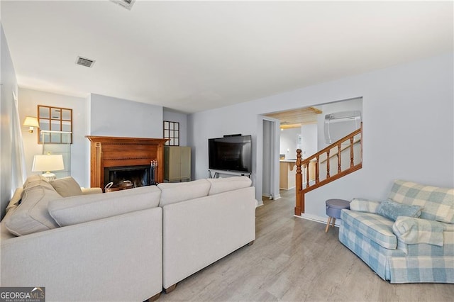 living room with light hardwood / wood-style floors