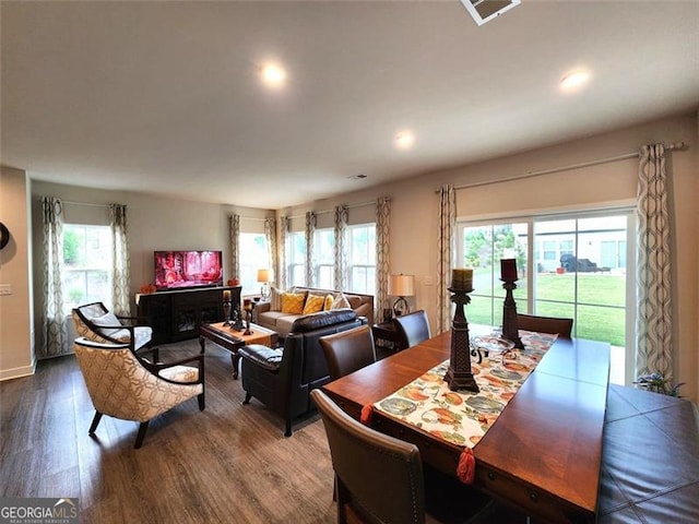 dining area with hardwood / wood-style flooring and plenty of natural light